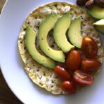 Fresh & Flavorful: Rice Cake with Avocado and Cherry Tomatoes