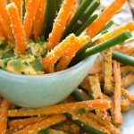 Crunchy Carrot Sticks Paired with Creamy Guacamole Delight